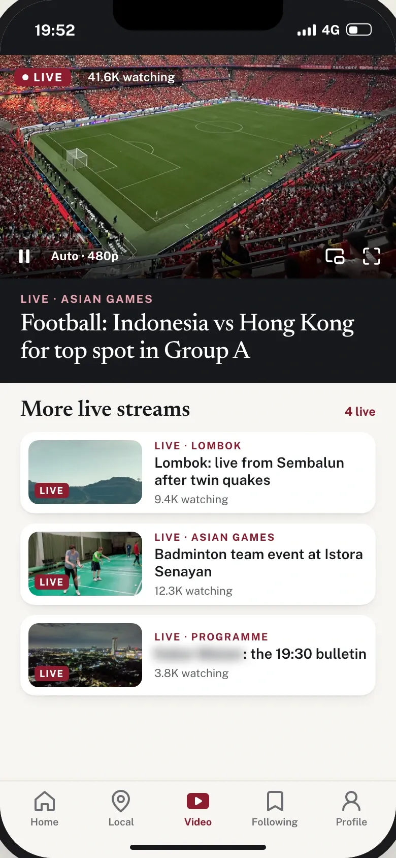 Live video screen playing an Asian Games football match in automatic quality, with three more live streams listed underneath and their viewer counts